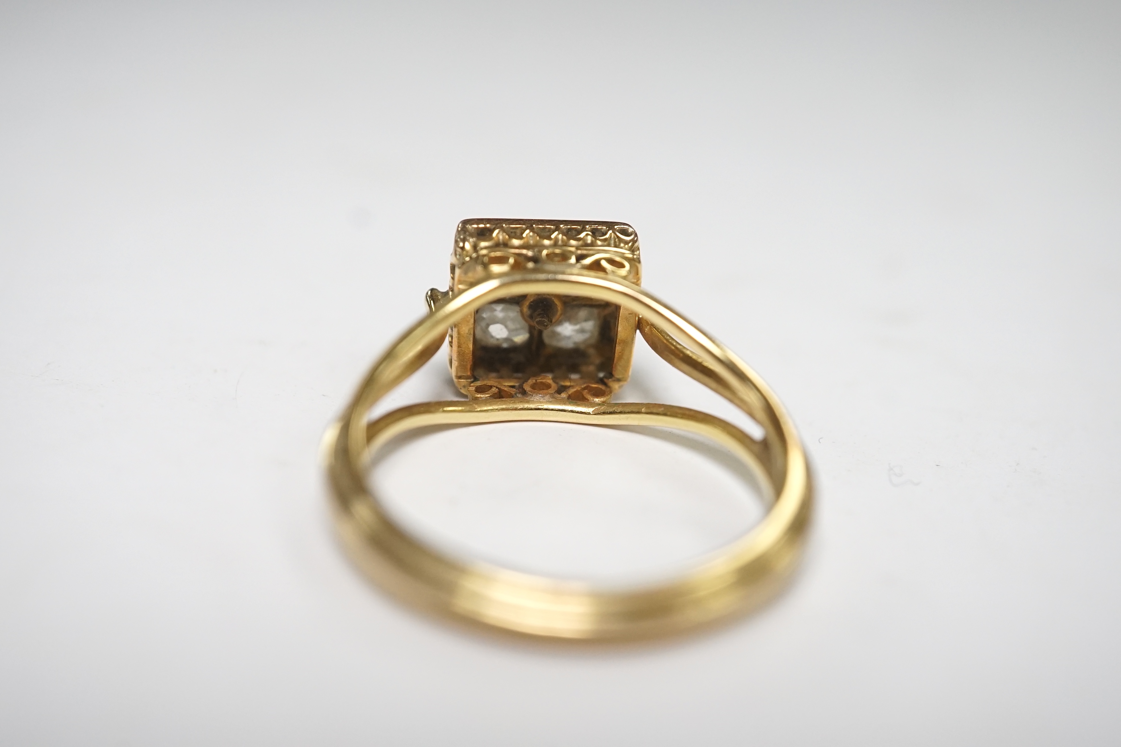 A yellow metal and four stone old mine cut diamond set square cluster ring, size O, gross weight 4.5 grams. Condition - fair to good